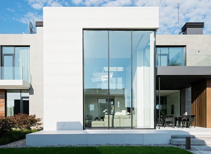 Modern white villa with ultra-high TY120/150 sliding doors