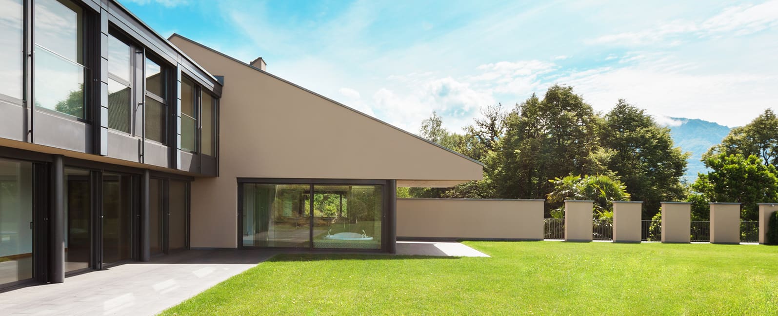 Completed residence seen from the garden with full-height sliding doors