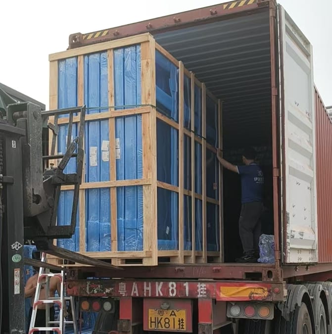 Crated windows being loaded into a 40HQ container at the Foshan factory