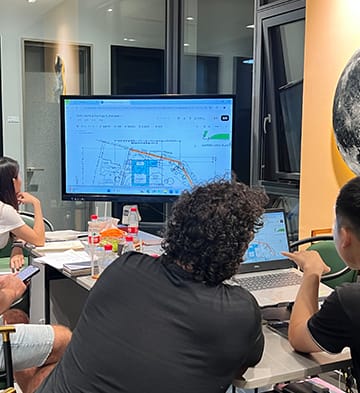 Buyers reviewing drawings in the EMD meeting room