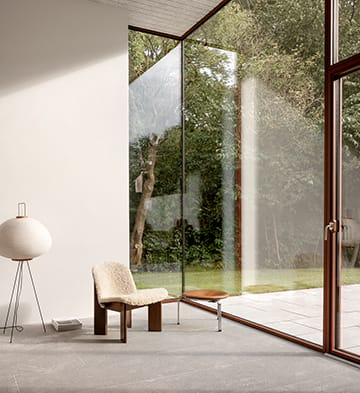 Floor-to-ceiling sliding door opening onto a garden