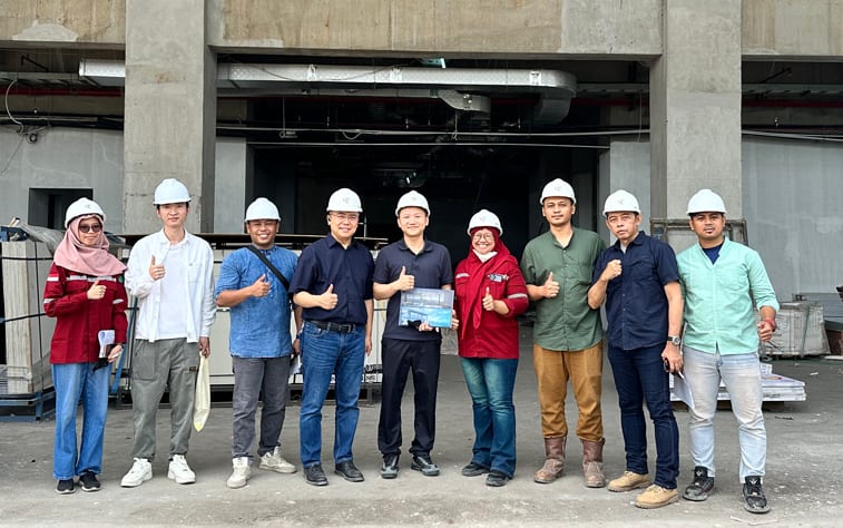 EMD team with a client on a construction site
