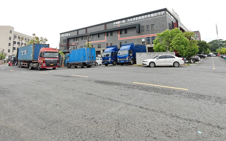 Containers and trucks loading at the EMD factory