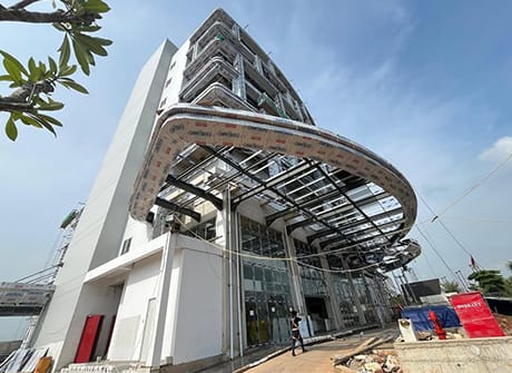 Curved structural glazing of the entrance canopy