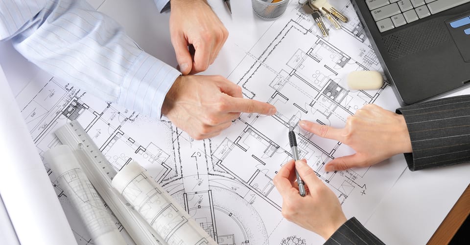 Architects reviewing façade drawings
