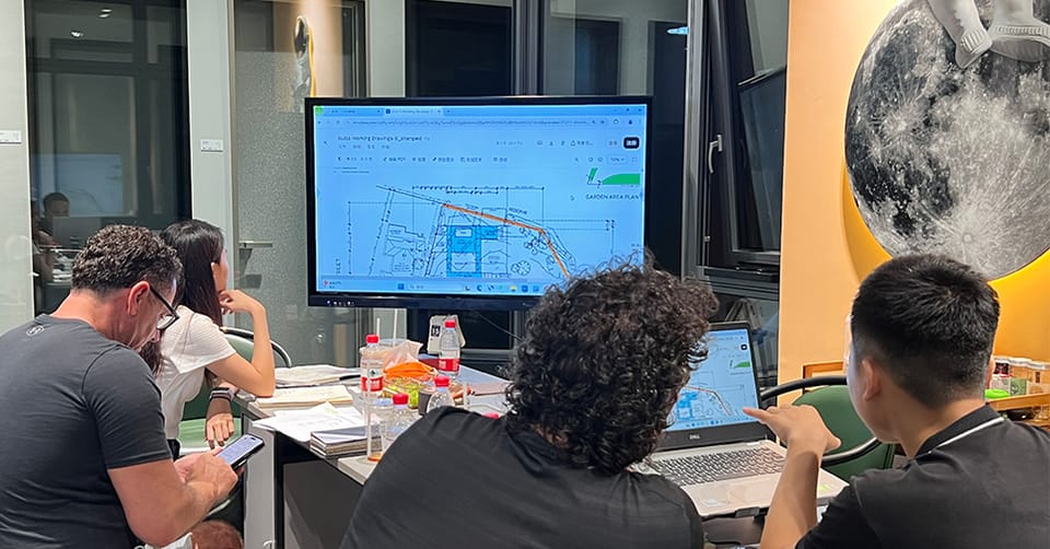 Project team reviewing a quotation on screen