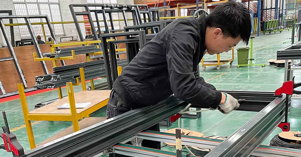 Technician assembling an aluminium frame