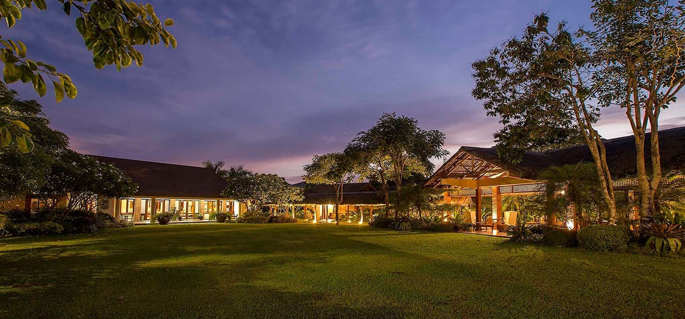 The resort at dusk with full-height sliding doors