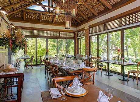 The restaurant with sliding walls open to the terrace
