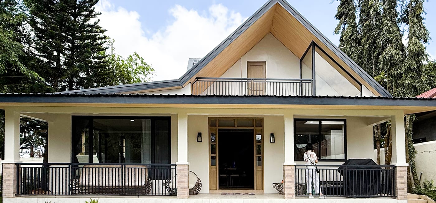 The finished house with sliding doors to the veranda and a gable window